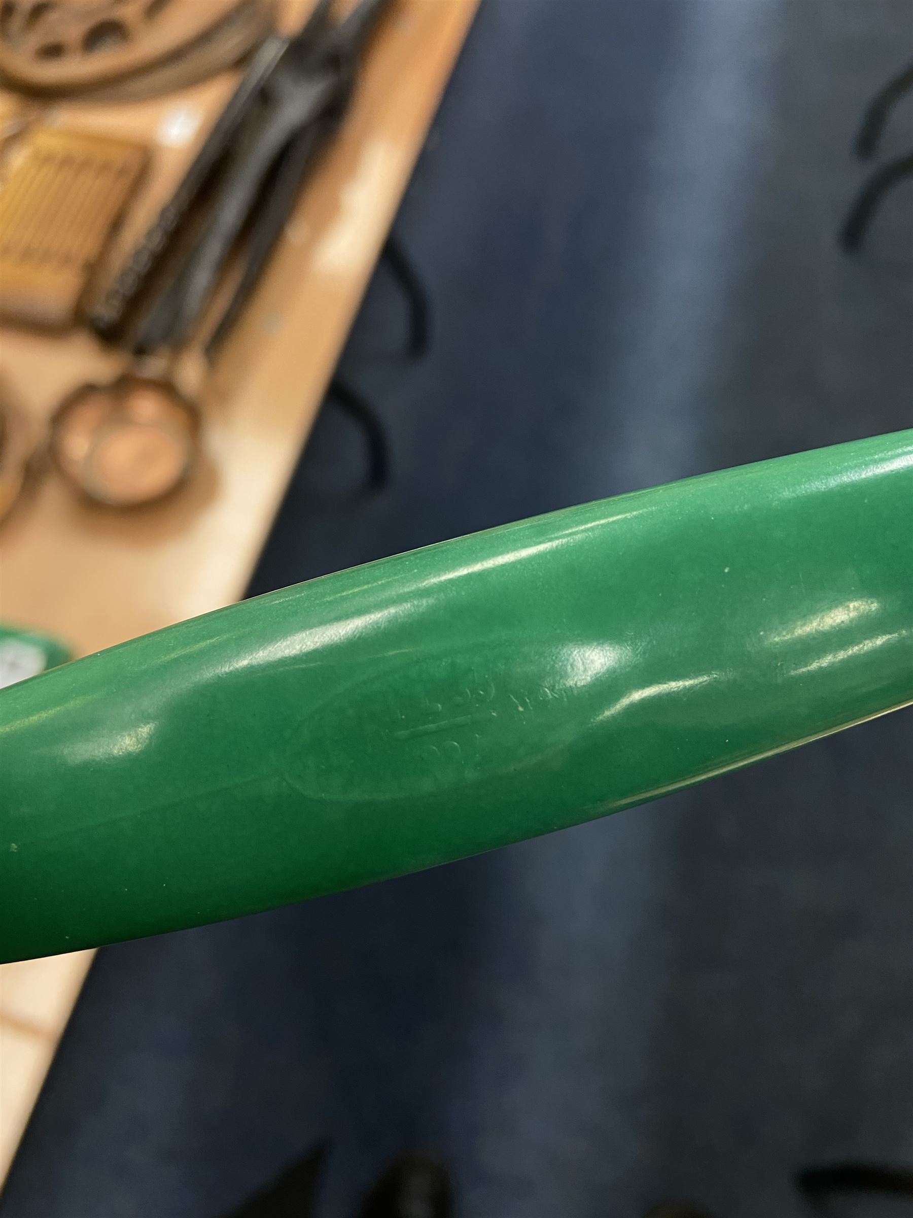 Jade green Bakelite telephone, of pyramid form with alphabet dial, brown braided handset cord and a base draw