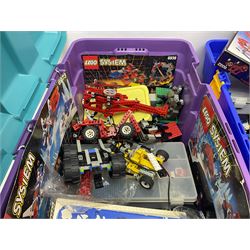 Lego - large quantity of part-built models and loose component parts including Lego Technic and Lego System, space and road vehicles, ships and boats, helicopter etc; together with two set boxes and folder  containing large quantity of instruction booklets; stored in two very large plastic boxes