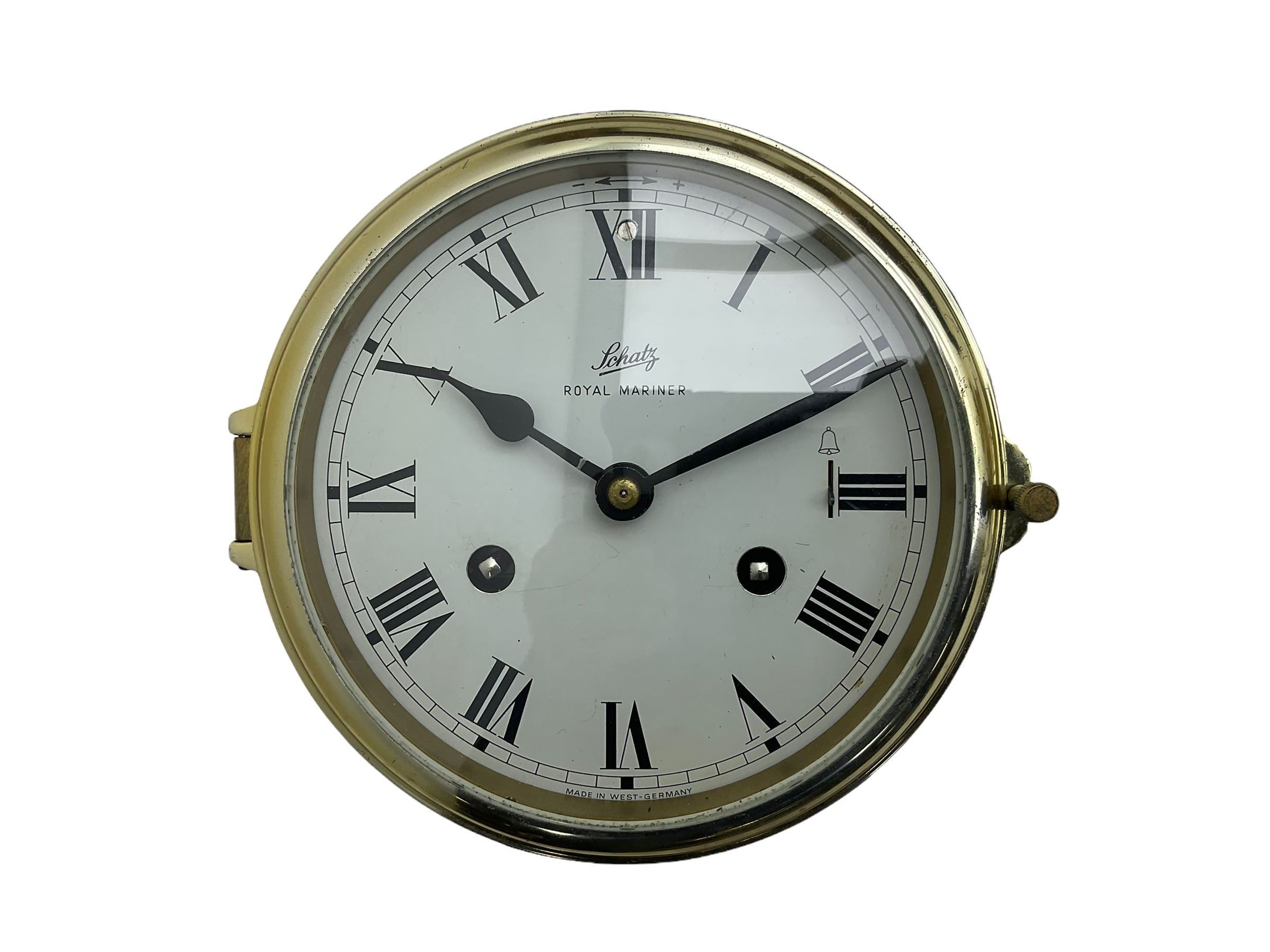 Eight-day 20th century brass cased “Schatz Royal Mariner” bulkhead clock, with a 6” dial, Roman numerals and minute track, bells on/off control, black spade hands with a brass bezel and flat bevelled glass, twin train spring driven balance wheel movement sounding the ships watches on a bell.
With a corresponding and matching Schatz open dial compensated aneroid barometer, with weather predictions and measuring barometric pressure in inches and millibars, with a curved spirit thermometer measuring temperature in Fahrenheit and Celsius, steel indicating hand and brass recording hand.
