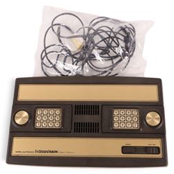 Mattel Electronics Intellivision Intelligent Television Master Component and twenty boxed games comprising Golf, Soccer, Lock N Chase, Reversi, Night Stalker, Math Fun, Baseball, Shark! Shark!, Skiing, Tutankham, Frogger, Popeye, Advanced Dungeons & Dragons, Draughts, Triple Action, Frog Bog, Mission-X, Space Battle, Bowling and Auto Racing 