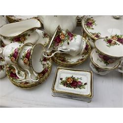 Royal Albert Old Country Roses pattern part tea and dinner service, to include seven dinner plates, five smaller plates, lidded twin handled soup tureen, two twin handled lidded tureens, teapot and coffee pot, salad bowl, oval serving dish, six twin handled soup bowls and saucers, six soup bowls, six cereal bowls, seven teacups, eight saucers and six side plates, sauce boat, together with clock, photo frame and quantity of placemats, coasters etc all decorated in the Old Country Roses pattern