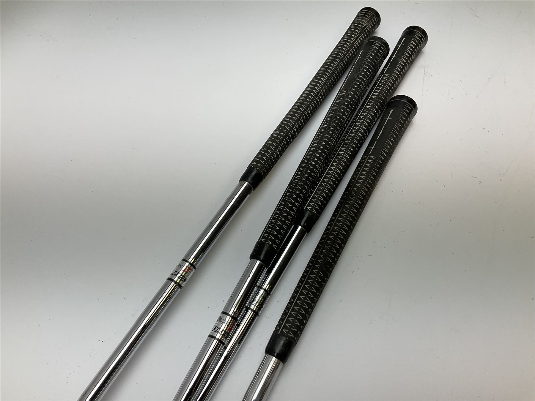 Golf - three early 20th century hickory shafted irons marked R. Simpson, Harrods Ltd etc; child's wooden shafted putter; two transitional wood grain steel shafted irons, one marked Tom Morris; and set of four Macgregor Tommy Armour woods (10)