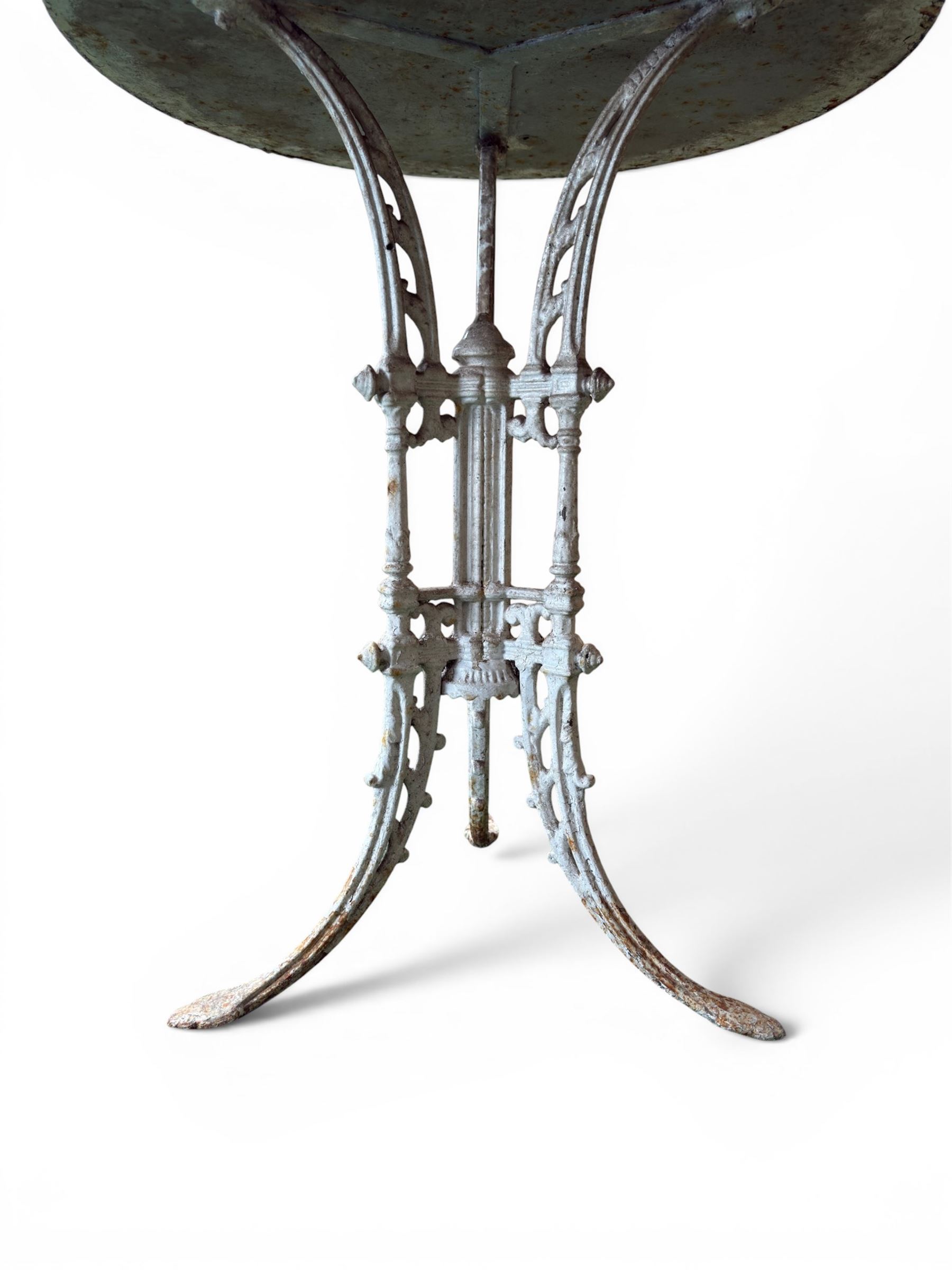 Victorian ornate cast iron garden table, trefoil base with central enclosed column, circular top with later marble, with registration mark