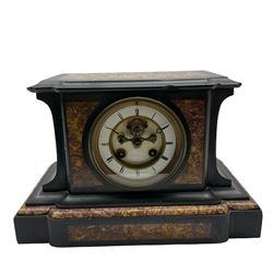 A French eight day striking mantle clock in a Belgium slate case with panels of contrasting variegated marble to the top and front, flat topped break-front case on a corresponding wide plinth, enamel two-piece dial with a visible “Brocot” dead beat escapement and jewelled pallets, steel moon hands within a flat bevelled glass and cast brass bezel, rack striking movement striking the hours and half-hours on a bell. With pendulum.


