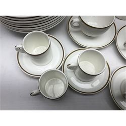 Wedgwood tea, coffee and dinner service for eight, comprising teapot, coffee pot, salt and pepper shakers, two milk jugs and sugar bowls, larger jug, teacups and saucers, coffee cans and saucers, dinner plates, dessert plates, side plates, oval plates, small bowls and larger bowls, all decorated with gilt rim on a white ground, with printed mark beneath (89)