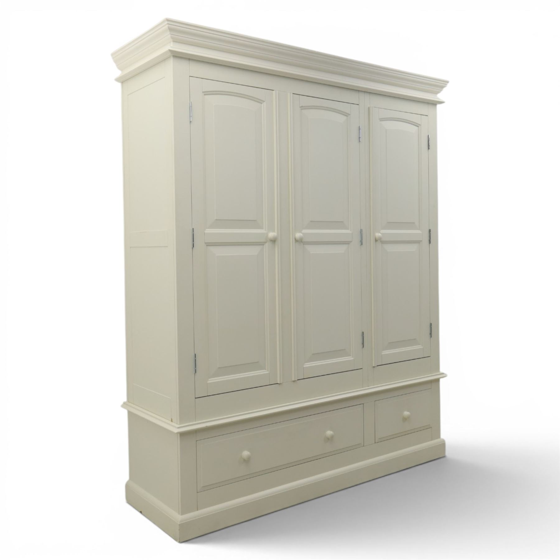 Modern white three door wardrobe, with two hanging section and shelving area, above a long drawer and a short drawer to the base, raised on a moulded plinth