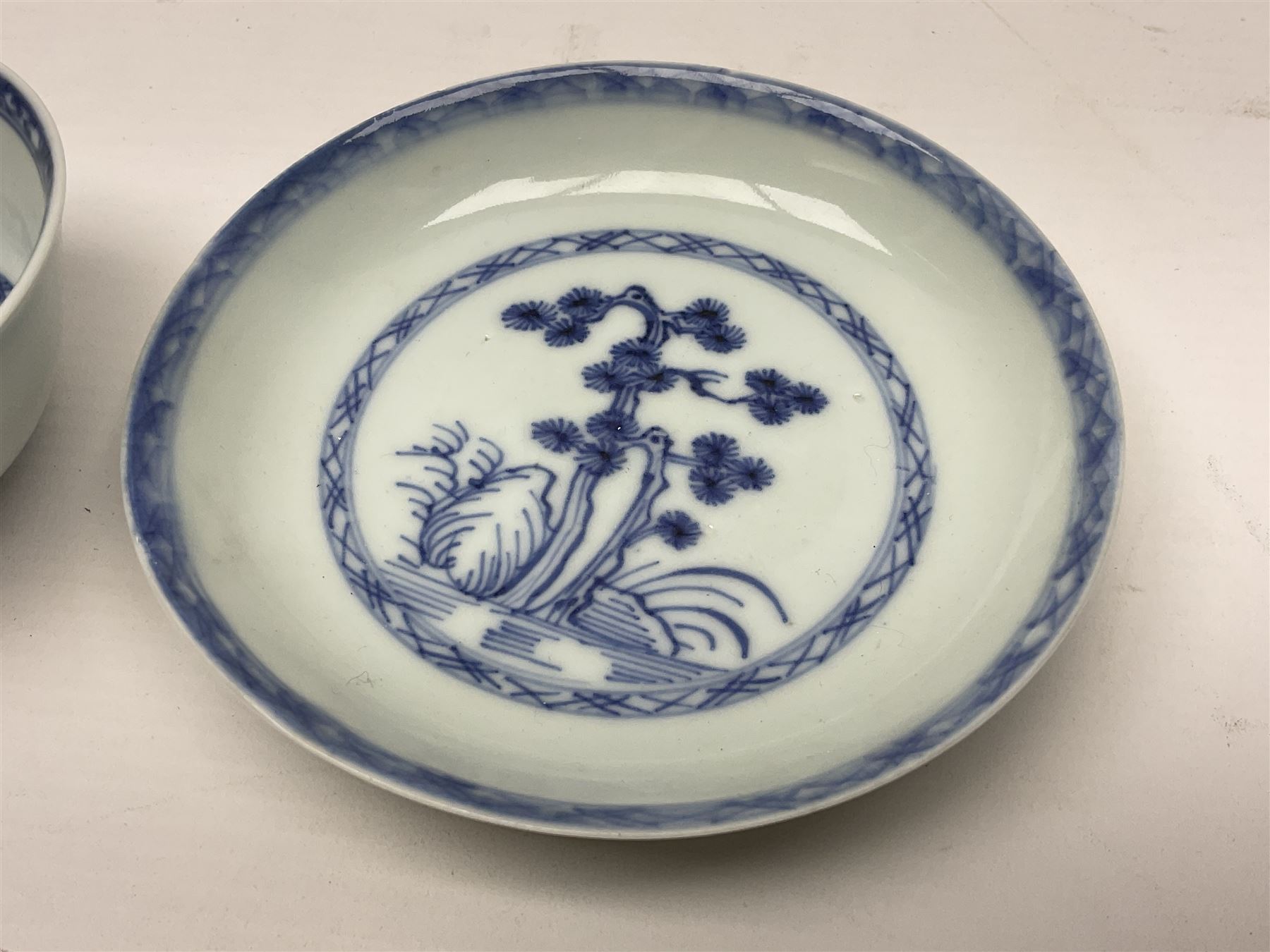 Chinese Nanking Cargo tea bowl and saucer, each decorated with pin tree, saucer with Christie's lot label beneath, tea bowl D7.5cm, saucer D11.5cm