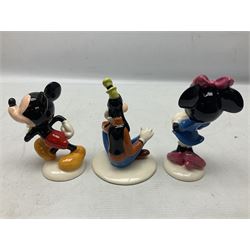 Three Royal Doulton The Mickey Mouse Collection figurines comprising Mickey Mouse MM1, Minnie Mouse MM2, and Goofy MM5, together withe three Royal Doulton limited edition miniature snowman character jugs comprising Christmas Stocking Snowman D7124, Christmas Cracker Snowman D7158 and Snowman D7062, all with original boxes 