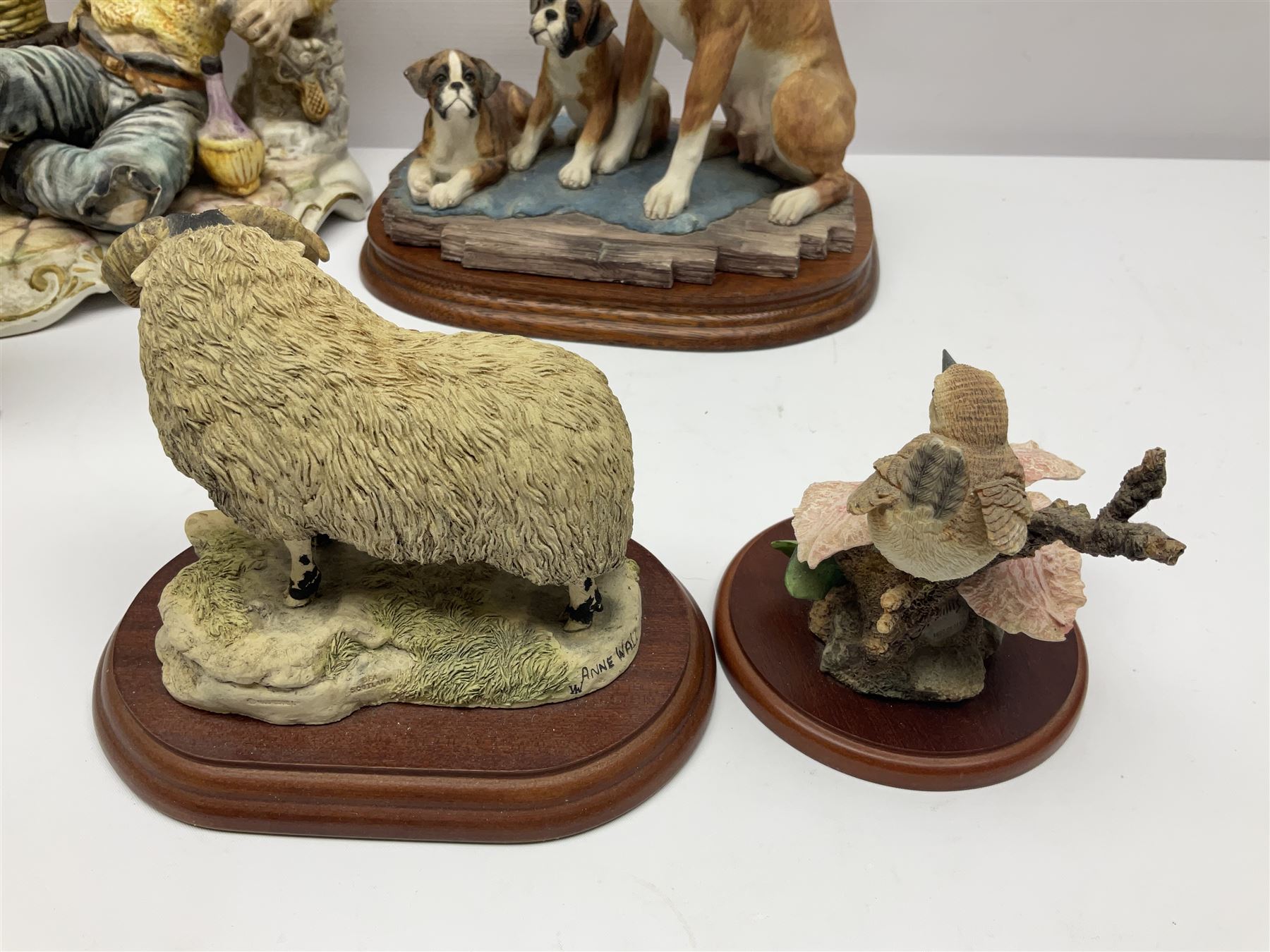 Three Border Fine Arts figures including Boxer with Pups, Capodimonte figure of a drunken pirate, and a brass dog (5)