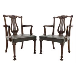 Pair late 20th century cherry wood Chippendale style elbow chairs, the shaped cresting rail relief carved with flower head, pierced lyre shaped carved with foliage, scroll carved and moulded arm supports, seat upholstered in green leather, tapering reeded supports