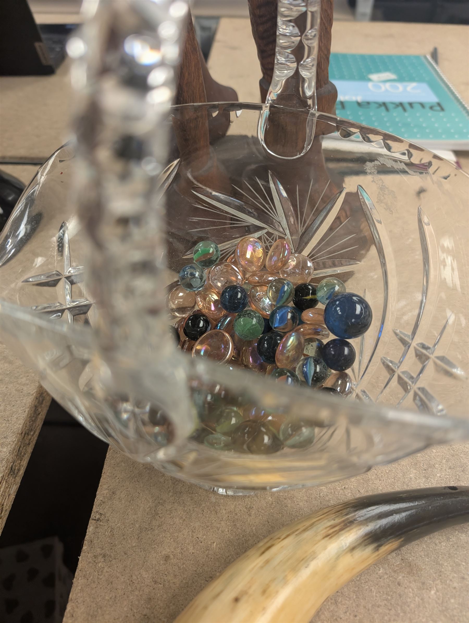 Carved wooden figure of a man holding a pineapple, together with a silver plated candelabrum, cut glass basket, etc, figure H64cm