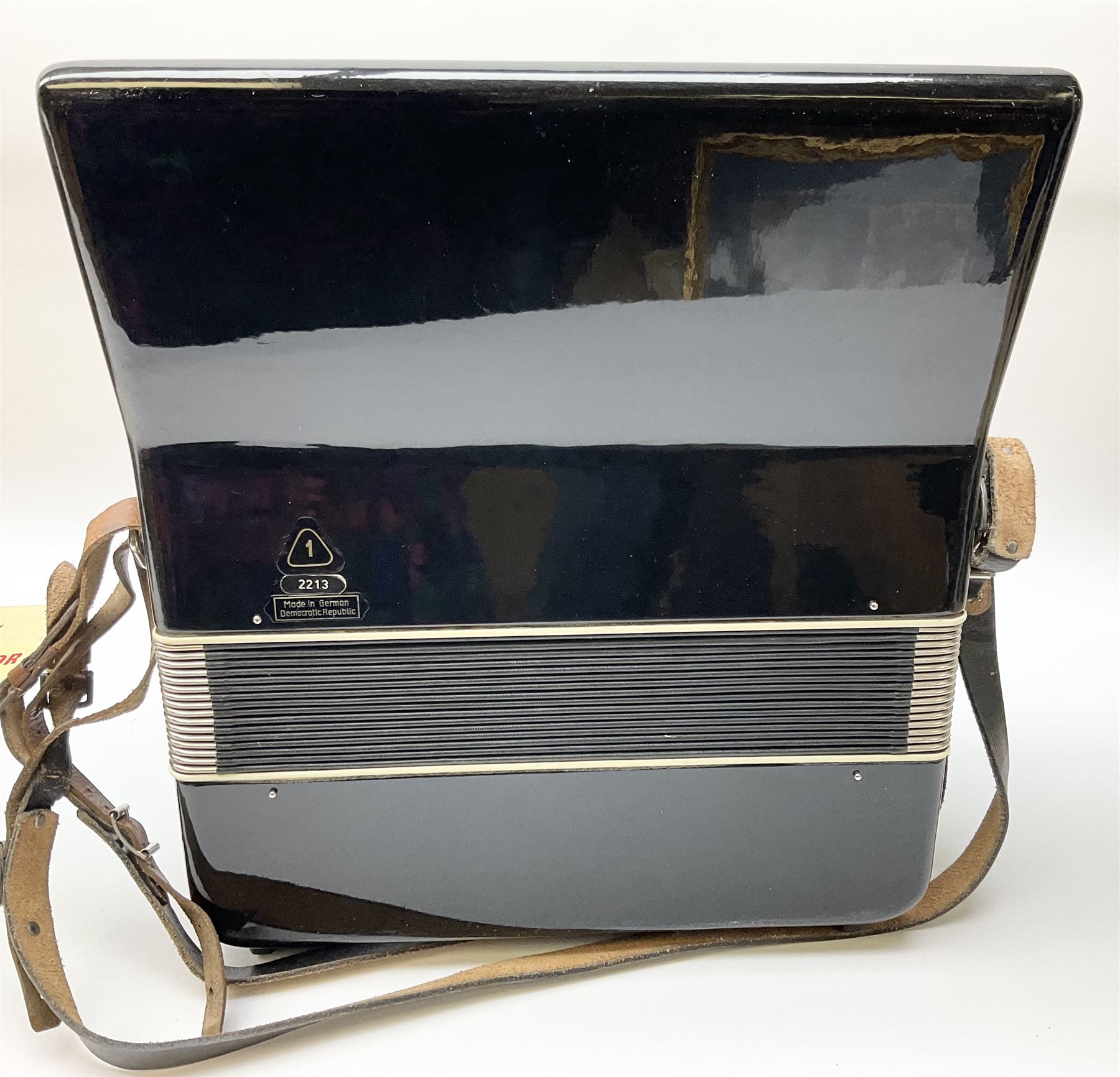 GDR Firotti piano accordion with black and silver case, sixteen keys and forty-eight buttons L38cm; in simulated reptile skin case with sheet music