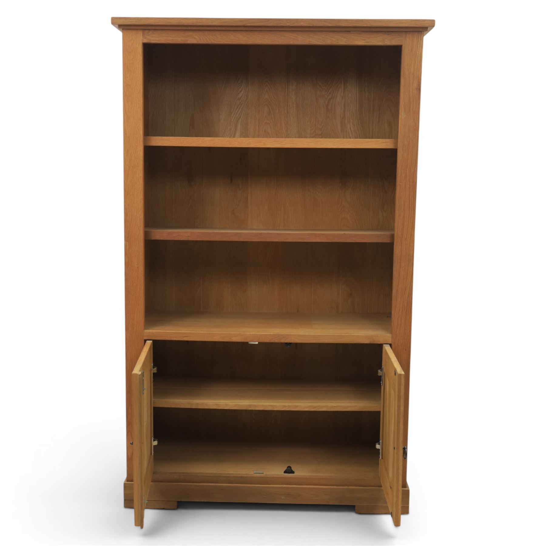 Light oak open bookcase fitted with three shelves, two cupboards, below