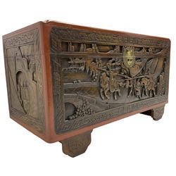 Mid-20th century Singapore camphor wood blanket chest, heavily carved depicting battle scenes and cityscapes 