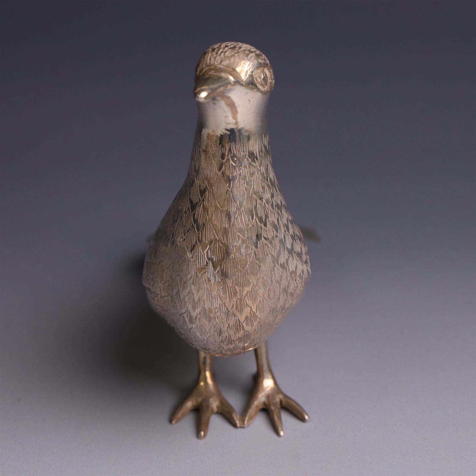 Mid 20th century Iranian silver model of bird, with engraved feathers, stamped with lion with scimitar to underside of tail, H11cm