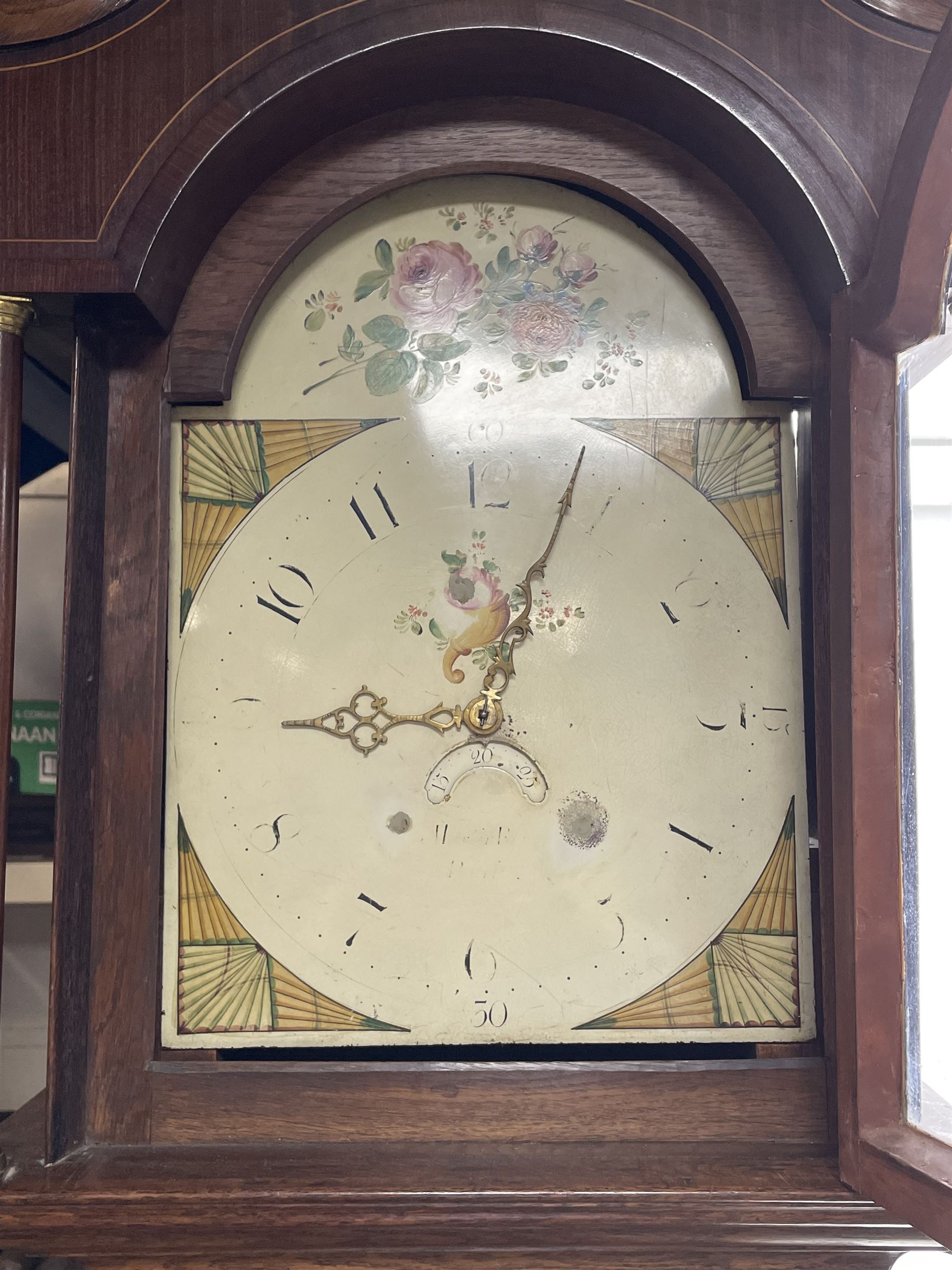 Early 19th century oak and rosewood banded longcase clock, scrolled pediment over stepped arch hood door, enamel painted dial indistinctly signed for a Penrith maker, 30-hour movement striking on bell