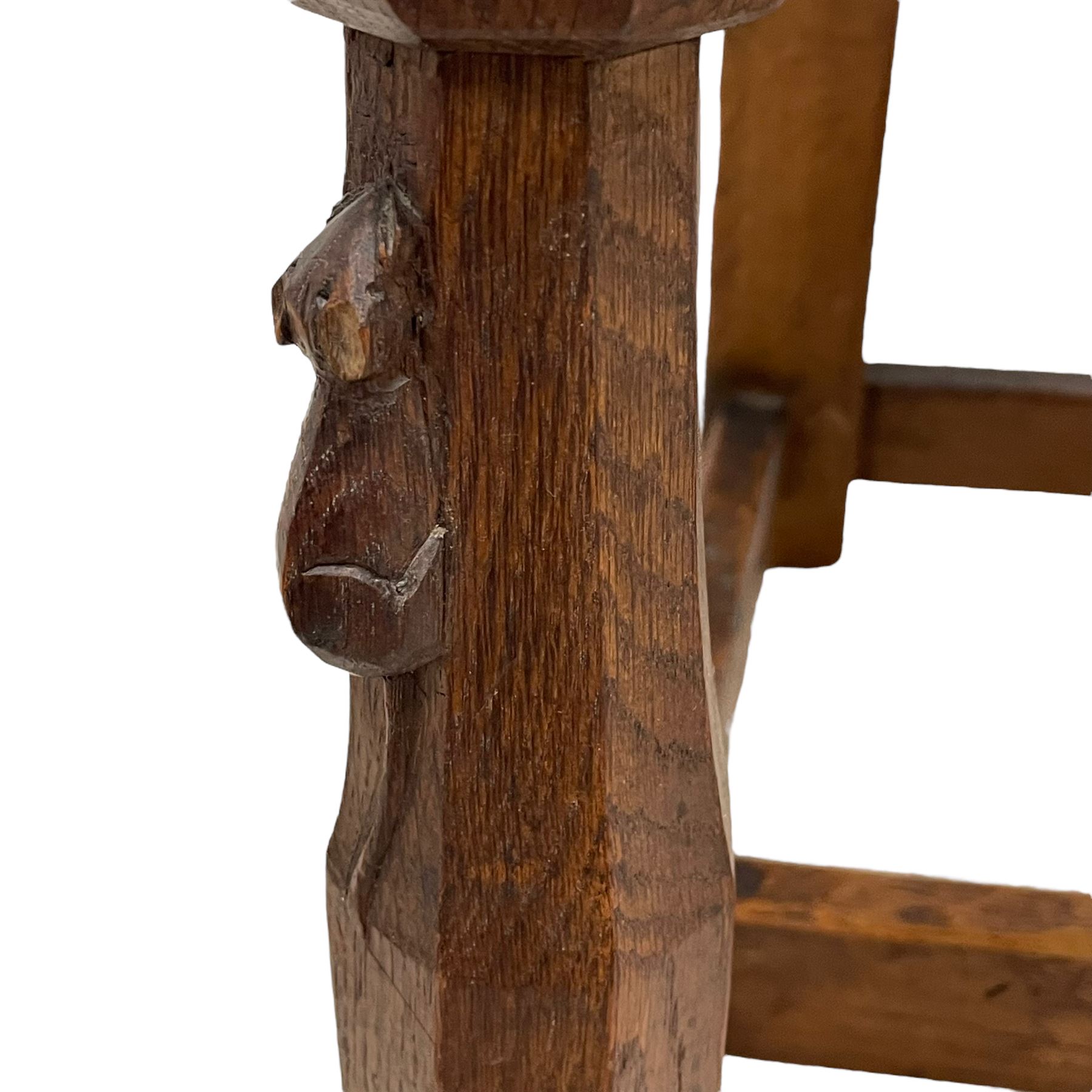Mouseman - circa. 1930s set of six (4+2) oak dining chairs, panelled back carved with the Bagshawe family crest, the moto 'Forma Flos Fama Flatus' over an arm grasping a bugle-horn with ribbon tie and Yorkshire rose motif, adzed frame, leather lattice strap seat, on octagonal supports united by stretchers, two carvers and four side chairs, each carved with mouse signature, by Robert Thompson of Kilburn 

Provenance: Owned since manufacture by the Bagshawe family, descendants of the Staithes Group Artist Joseph Richard Bagshawe RBA (1870-1909).