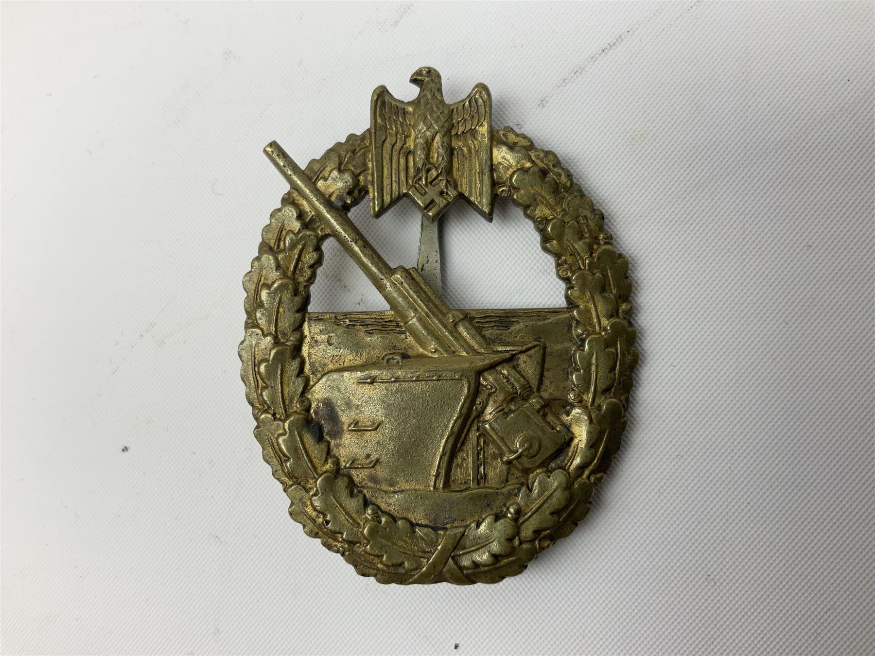 Three WW2 German badges comprising Blockade Runner War Badge and Coastal Artillery badge, both marked 'Fec Otto Placzec Berlin'; and Infantry Assault Badge; all with fixing pins (3)