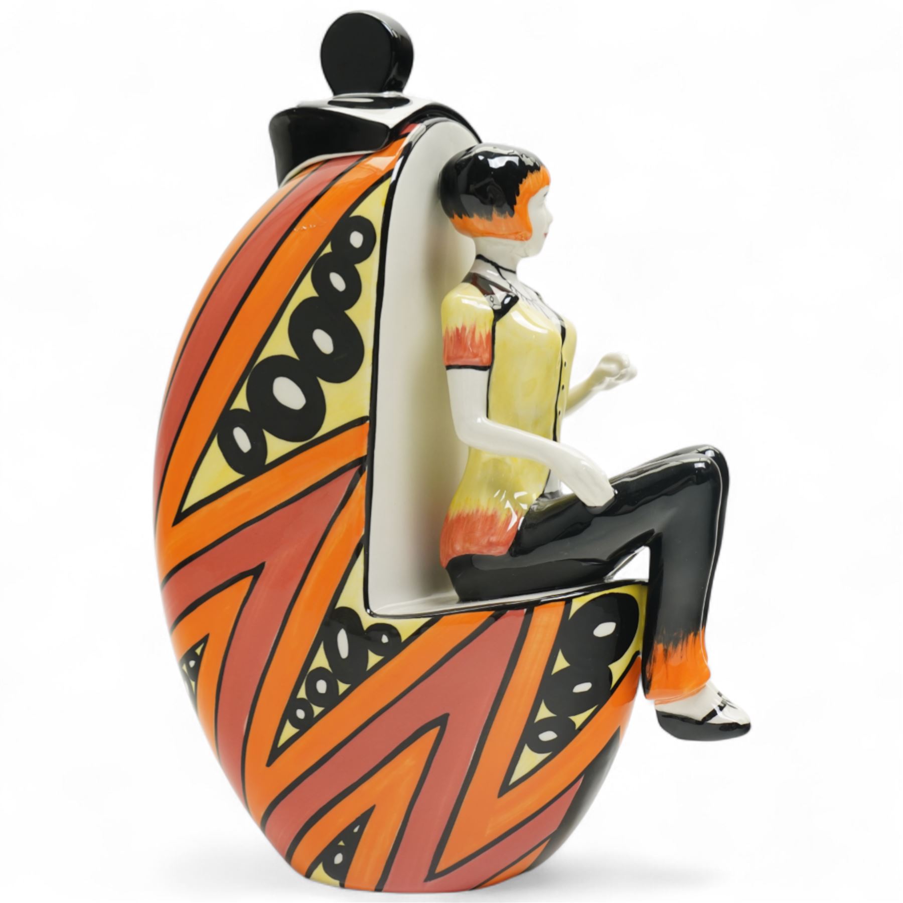 Lorna Bailey limited edition Deco lady figure, modelled as seated on covered pot, with geometric painted striped and spotted decoration, signed and numbered 12/50 to base, H25cm 