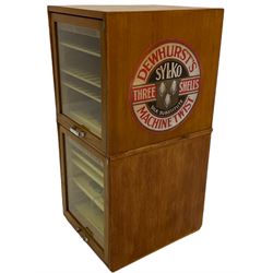 Haberdashery cabinet, with Dewhurst's Sylko Three Shells Machine Twist branding, consisting of two sections to the front, each with four shelves and door to the back for access, with Abel Morrall Ltd makers plaque, H85cm, W36cm. 