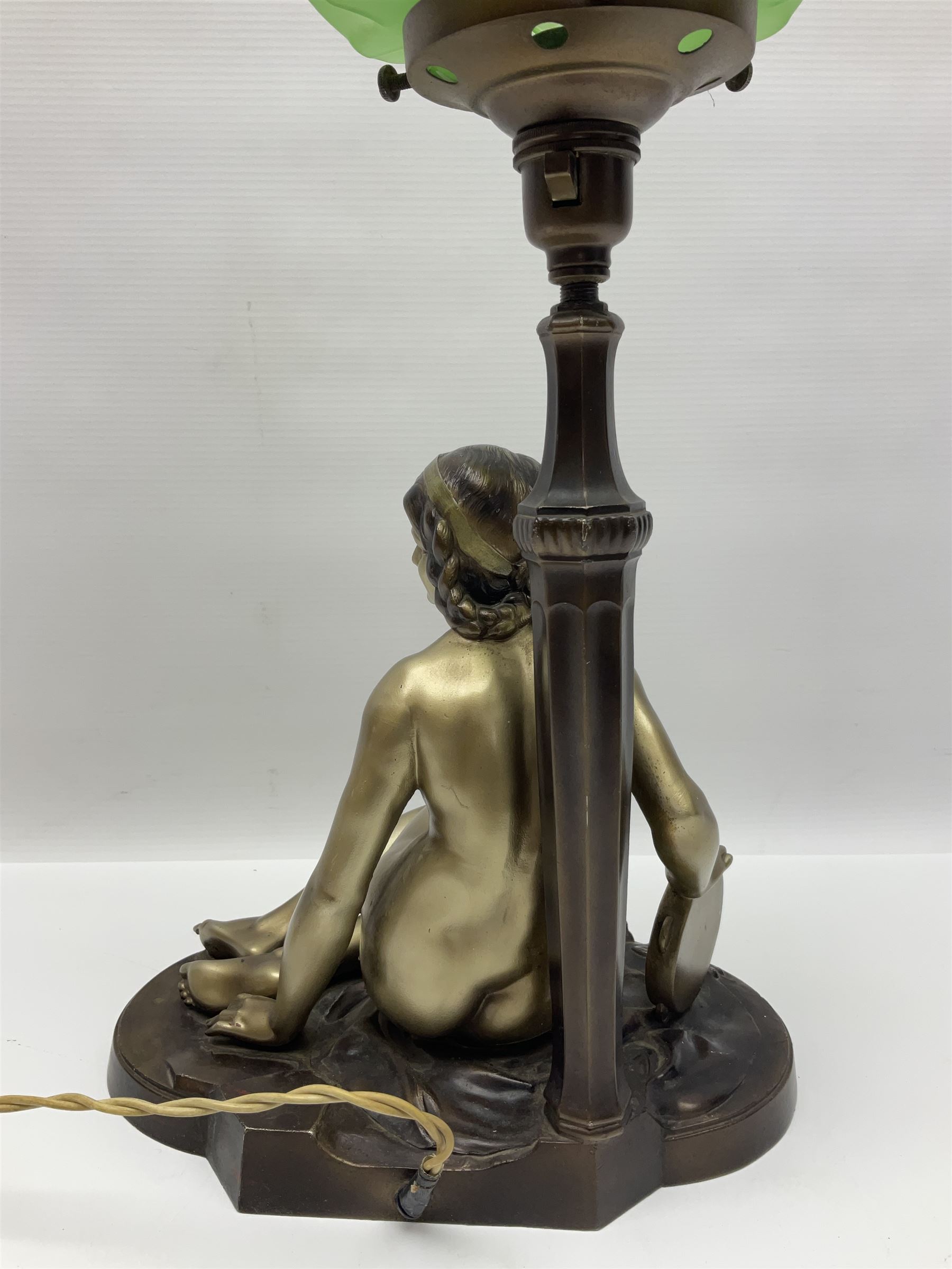 Art Deco style bronzed and gilded spelter figural table lamp with green Uranium glass shade; H48cm, another table lamp; and a bisque group