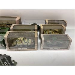 Sixteen Atlas Editions die-cast models of military vehicles including six Ultimate Tank Collection; all in perspex display cases; fourteen boxed; with associated paperwork (16)