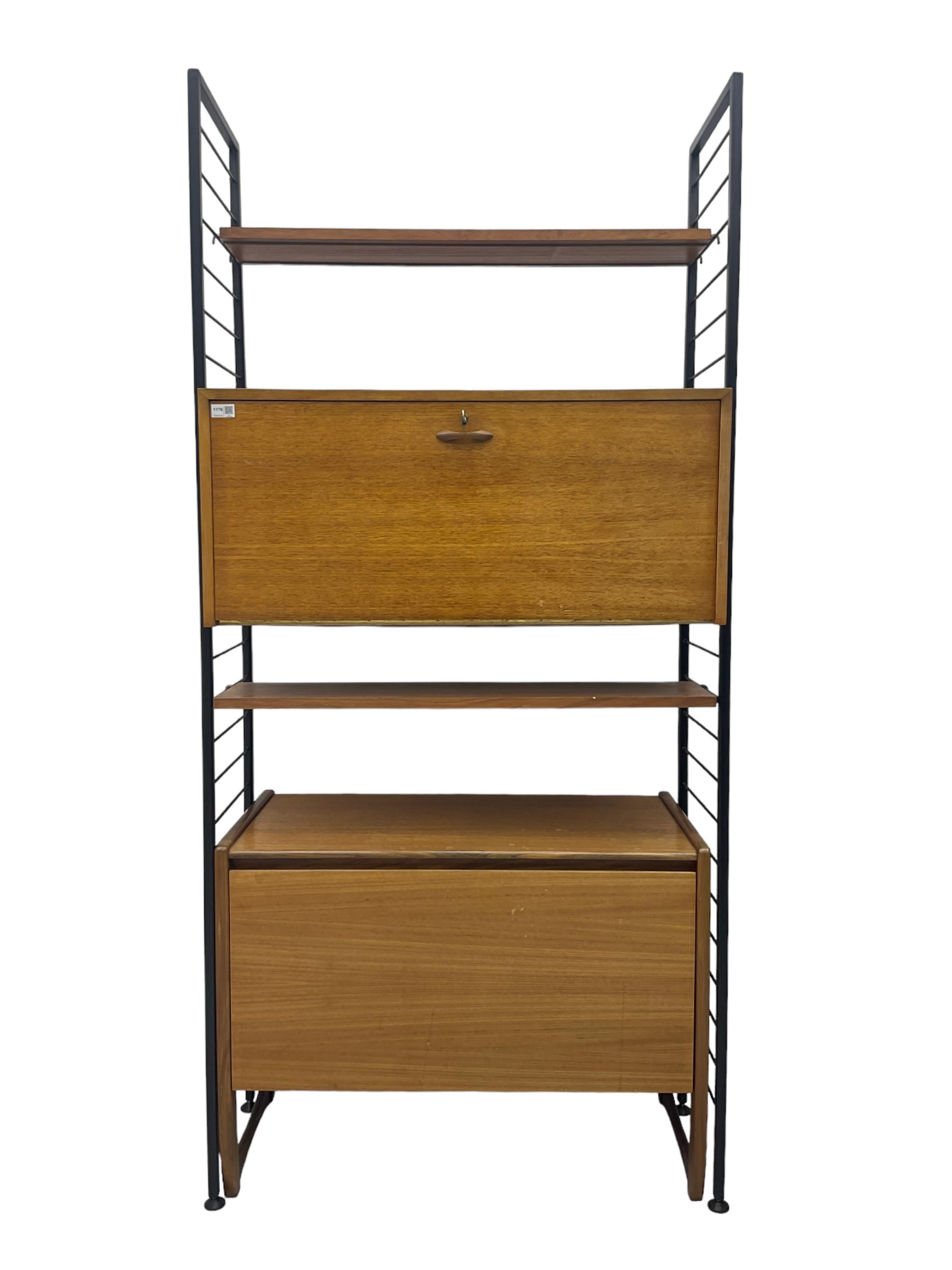Staples Ladderax - mid-20th century teak and metal framed modular wall unit, fitted with central fall-front cupboard enclosing correspondence dividers, over secondary separate teak fall-front cupboard, adjustable shelf to top