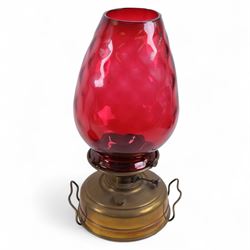 Victorian brass oil lamp with cranberry glass shade marked A L & Co, together with another Victorian lamp with turquoise glass reservoir and column, largest H77cm 