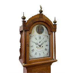 William Gostling of Diss  (Norfolk)-  Late 18th century 8-day oak longcase clock c1780-90, break arch top with scalloped cresting and three brass finials, glazed break arch hood door flanked by turned pilasters with brass capitals, trunk with a long trunk door and rounded top on a square plinth with an applied and shaped skirting, early painted Wilson of Birmingham dial with Roman numerals and five minute Arabic's, matching steel hands and second pointer, arched square ended calendar aperture with date disc behind, floral spandrels within gesso borders and a painted rocking automaton representing Mercury to the break arch, dial pinned via a false plate to a weight driven rack striking movement with a recoil anchor escapement, striking the hours on a cast bell. With pendulum weights and key. 
William Gostling (II) is recorded as working in Diss from 1774 to 1797, succeeded by widow Anne and son George . The dial of this clock is illustrated and discussed in detail in M.F. Tennants book 