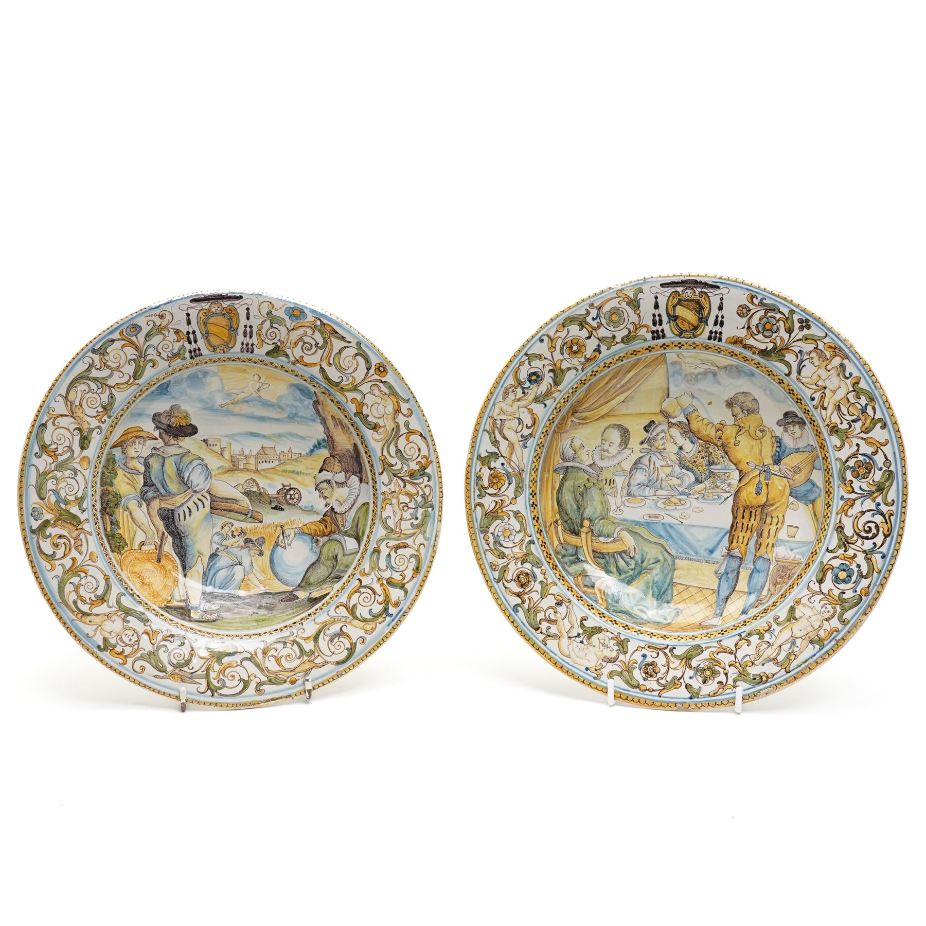 Pair of 19th century Italian majolica plates decorated in 17th century Castelli design with  figures and landscapes etc D27.5cm
