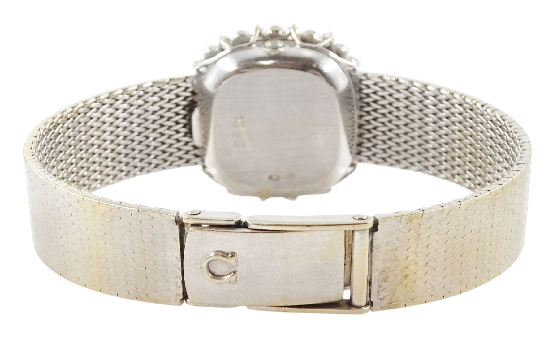 Omega ladies 18ct white gold quartz wristwatch, silvered dial with dot hour markers, round brilliant cut diamond bezel, hallmarked, on integral 18ct white gold bracelet, stamped 750
