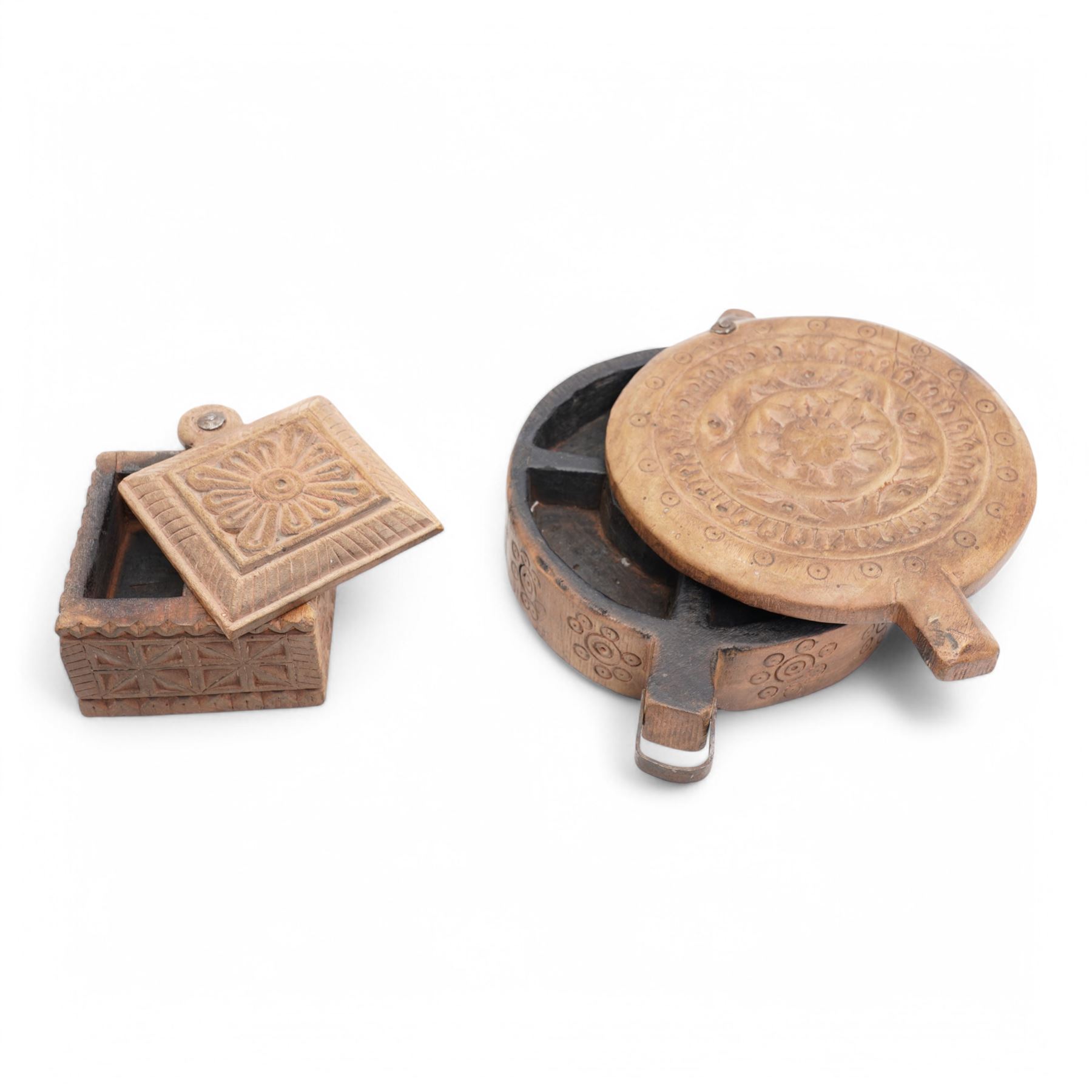 Two Indian carved hardwood boxes with covers largest D28cm 