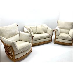 Ercol 'Renaissance' light ash framed three piece suite - three seat sofa and pair matching armchairs, with loose cushions upholstered in cream fabric
