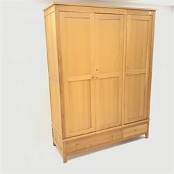  Light oak triple combination wardrobe, three doors above one long and one short drawer, stile supports, W153cm, H204cm, D55cm  