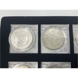 Seven United States of America silver Morgan dollar coins, dated 1884, 1901 O, 1902 O, 1903, 1904 O, 1921 D and 1921