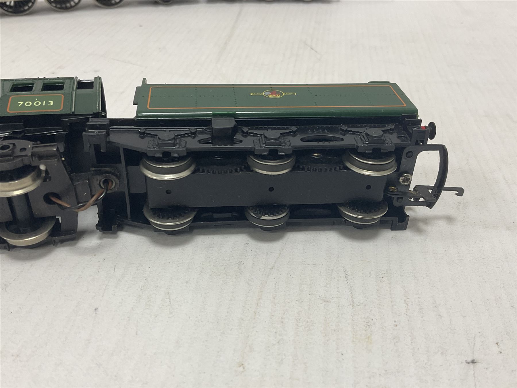 Hornby ‘00’ gauge - four steam locomotives comprising Britannia Class ‘Britannia’ 4-6-2 no.70000 in BR green; Britannia Class ‘Oliver Cromwell’ 4-6-2 no.70013 in BR green; Princess Class 4-6-2 no.6201 in LMS crimson; Coronation Class ‘Duchess of Sutherland’ 4-6-2 no.6233 in LMS crimson; one further tender (5) 