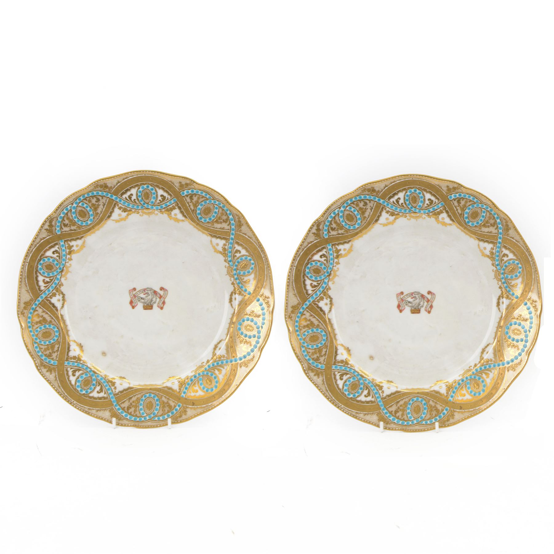 Pair of 19th century H&R Daniel porcelain armorial plates, each decorated with a central painted lion crest and banner inscribed with the Lloyd family motto in Welsh, 'Heb dduw heb ddym, Dhuw a digon' (Without God without anything, God is enough), within a gilt detailed and turquoise jewelled rim, each with puce printed mark verso, D26cm