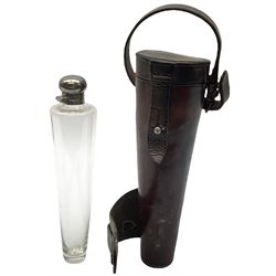 Tapered conical glass hunting flask with silver plated screw top, housed in in a leather case with straps L23.5cm. 