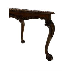 Chippendale Revival - hardwood extending dining table, rectangular gadroon carved top, on acanthus carved cabriole supports with ball and claw feet, with two additional leaves; together with a set of eight (6+2) dining chairs, shaped cresting rail over pierced and carved splat, upholstered drop-in seat, on acanthus carved cabriole supports with ball and claw feet