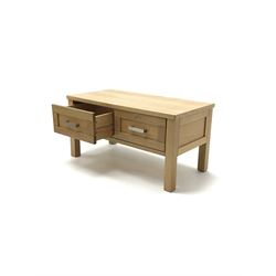 Light oak coffee table with two drawers, stile supports  