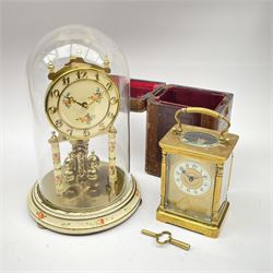 Late 19th century brass carriage timepiece clock, Arabic enamel chapter ring, single train driven movement, with leather case (H12cm), and a mid to late 20th century 'Kundo' anniversary clock under glass dome (H23cm)