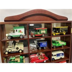 Collection of die-cast vehicles to include Corgi, Dinky, Lledo and Days Gone, housed in six wood display units