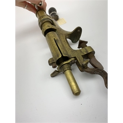 Two 19th century brass 12-bore cartridge making tools comprising bench mounting Bartram & Co Patent 'Nimrod' re-loader and J.C. Cocker Patent 5535 redecapper with turned wooden rammer (2)