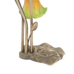 Art Nouveau Tiffany style table lamp, the bronzed base modelled as lily pads leading to tendrils and three branches supporting green and yellow glass lily flower shades, H42cm