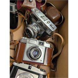 Collection of vintage cameras, including Zeiss Ikon, Canon Canonet, Ensign, etc