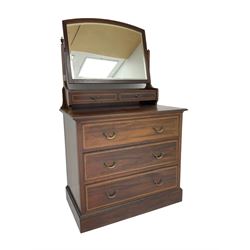 Edwardian inlaid mahogany dressing chest, arched bevelled swing mirror back over two trinket drawers, fitted with three drawers to base
