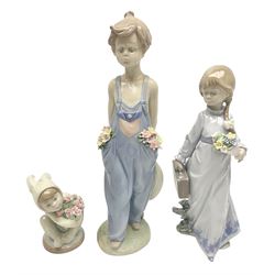 Three Lladro figures, comprising Pocketful of Wishes no 7650, School Days no 7604 and A New Friend no 1506, all with original boxes, largest example H26cm