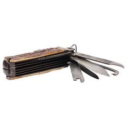 19th century coachman's folding pocket knife, the steel frame engraved with chevrons and tendrils, with antler grip scales, including set with a coachman`s key, leather punch, corkscrew, hoofpick, knife blades etc