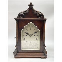 Early to mid 19th century rosewood Gothic cased bracket clock, ogee pointed arch top with carved scrolling foliage mounts, canted case with a cusped and pointed arch glazed door, silvered Roman dial engraved with trailing scroll work and cartouche inscribed 'French City Observatory, London no. 1167', multi-stepped base on compressed feet, twin fusee movement striking the hours on coil, the sides glazed with bevelled glass, the rear door with metal grille and fabric lined
