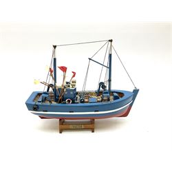 Wooden model of RMS Titanic, on a fixed black stand bearing plaque inscribed 'Titanic 1912', L54cm, H22cm, together with model of a sloop, gaff rigged on stand bearing plaque inscribed 'Sloop' L32cm, H42cm; and model of a fishing trawler on a stand bearing plaque inscribed 'Chalutier' L35cm, H28cm (3)